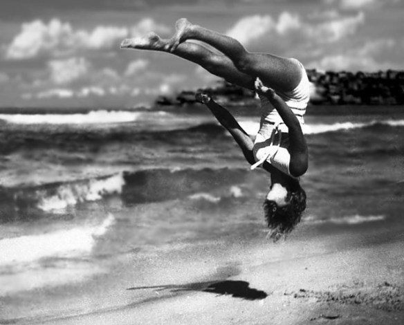 Peggy Bacon in mid-air backflip, Bondi Beach, 1937.
